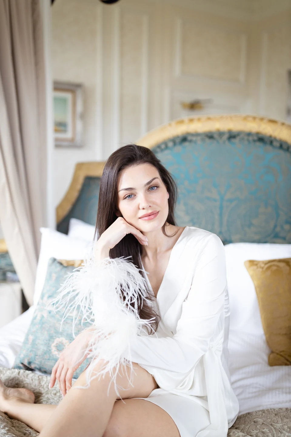 Bride relaxing in an armchair before the wedding