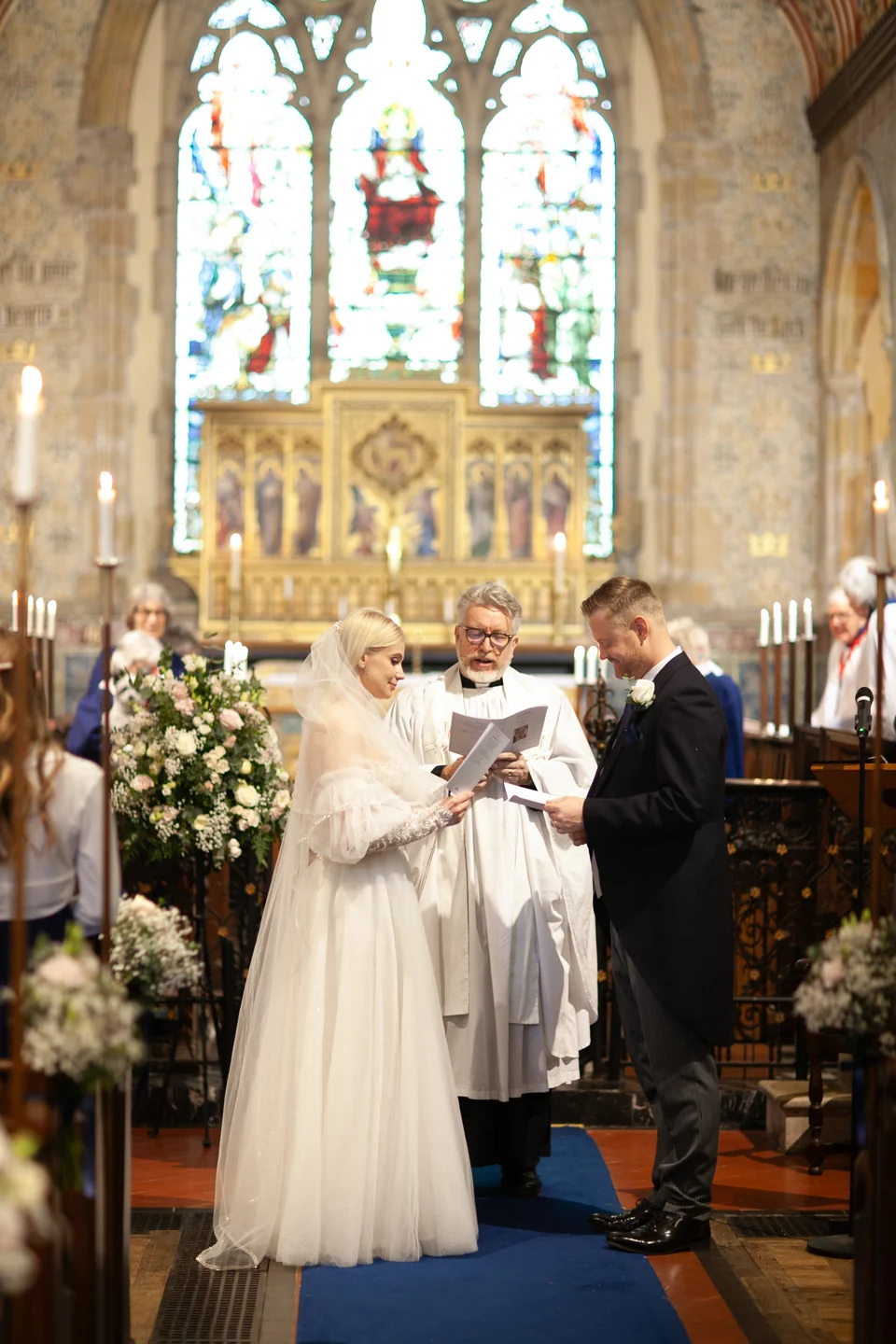 Couple exchanging vows during a church ceremony