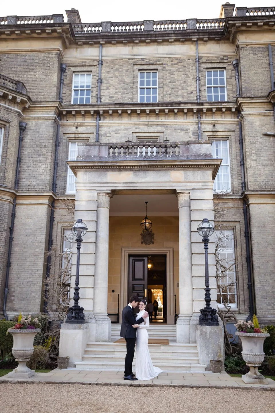 Intimate wedding reception in a charming venue in West Sussex, showcasing elegant decor and joyful celebrations among guests.