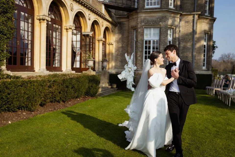Bride and groom sharing a quiet moment together during their wedding reception in West Sussex, surrounded by nature.