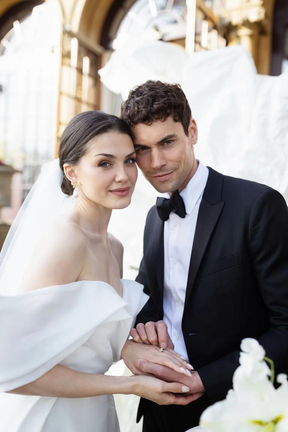 Beautiful bride and groom sharing a romantic moment during their wedding ceremony in Sussex, capturing love and joy