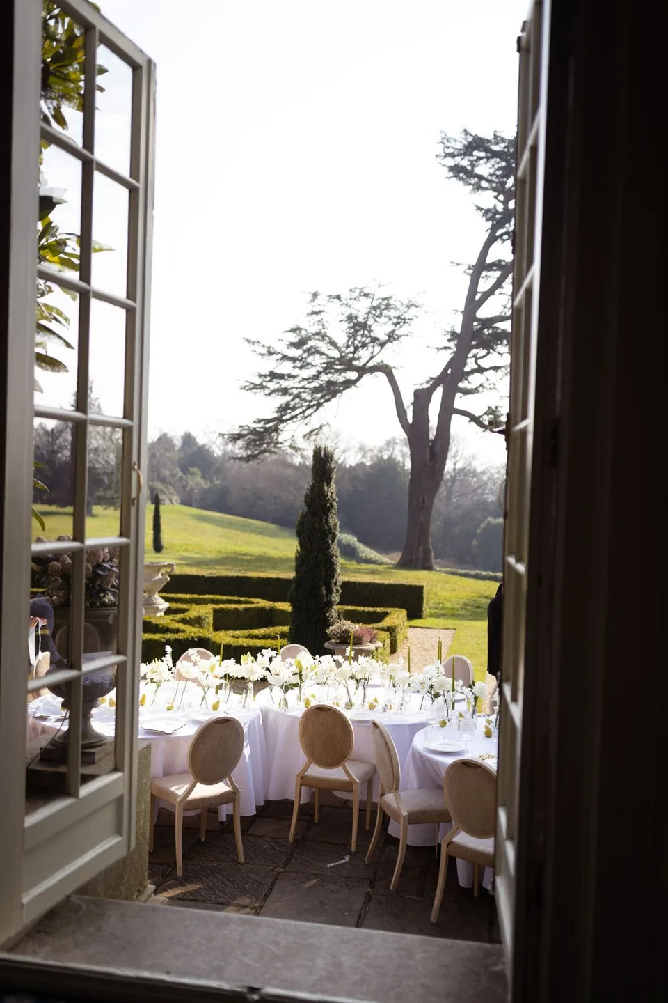 Beautifully arranged wedding table settings at a venue in West Sussex, ready to welcome guests for the celebration.