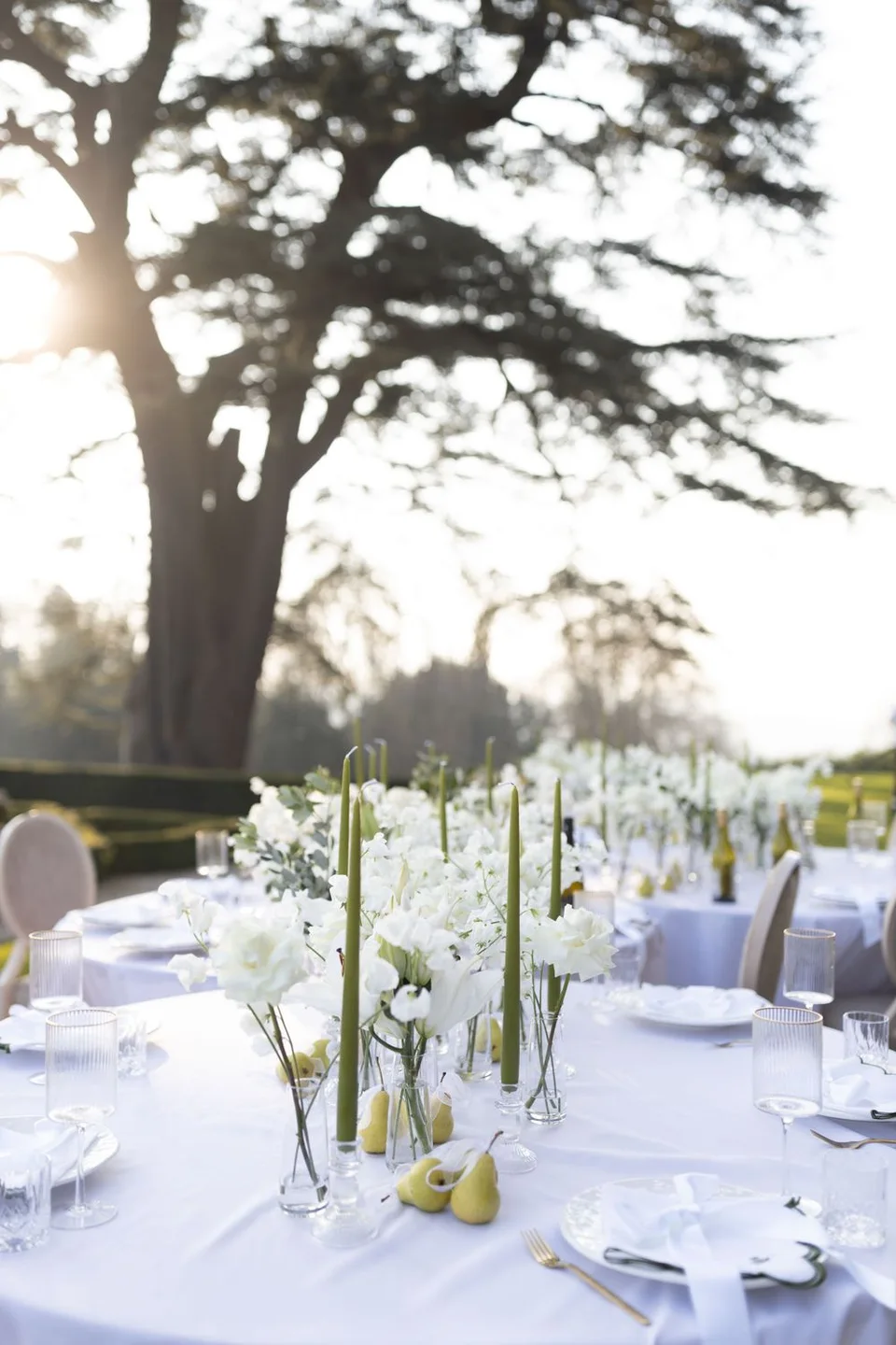 Beautifully set wedding table with floral centrepieces at a venue in Kent, ready for guests to celebrate the couple's love.
