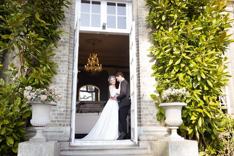 Bride and groom sharing a quiet moment together during their wedding reception in West Sussex, surrounded by nature.