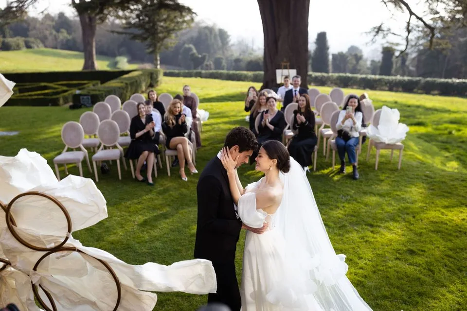 Couple exchanging heartfelt vows during their intimate ceremony in East Sussex, surrounded by close family and friends.