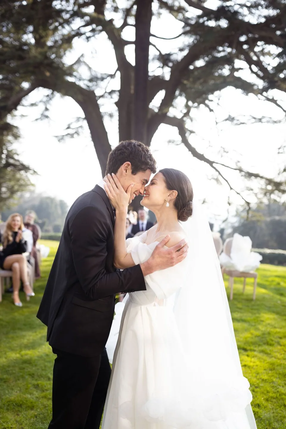 Beautiful bride and groom sharing a romantic moment during their wedding ceremony in Sussex, capturing love and joy