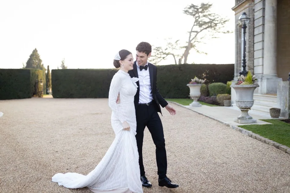 Intimate wedding reception in a charming venue in West Sussex, showcasing elegant decor and joyful celebrations among guests.