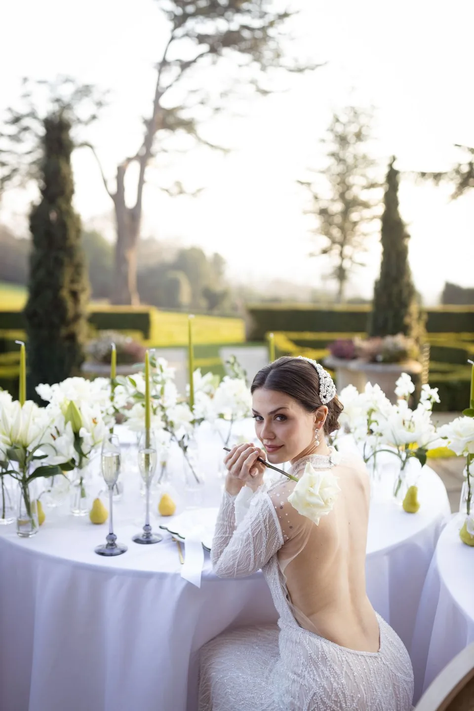 Stunning bridal portrait taken in a beautiful garden setting in Sussex, highlighting the elegance and beauty of the bride.