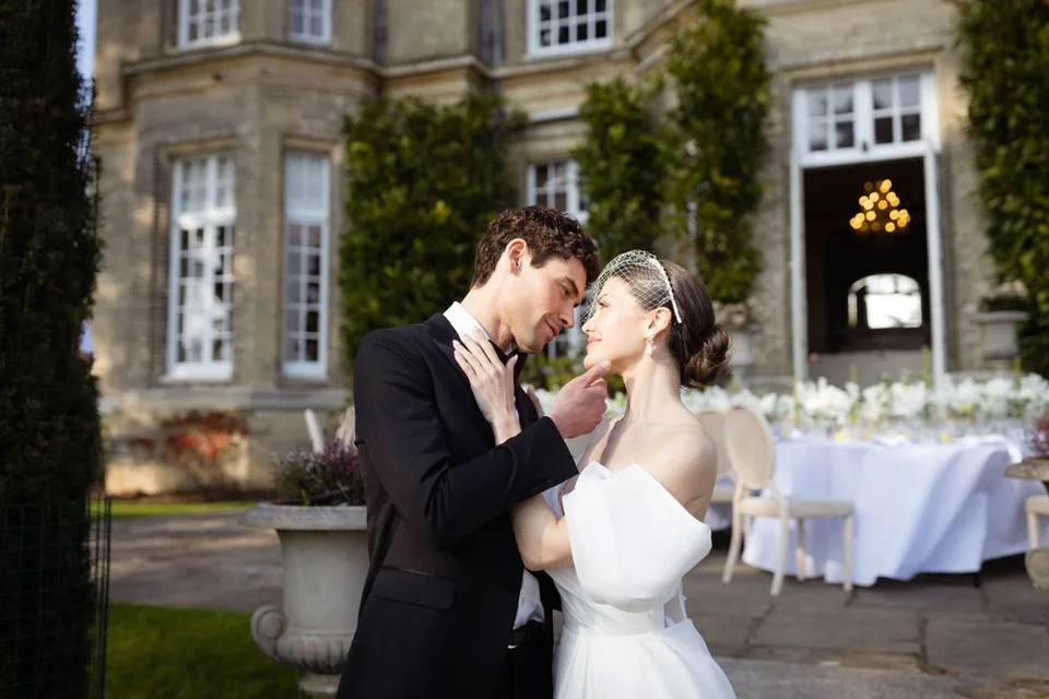Candid moment of laughter and joy shared between the couple during their wedding ceremony in Kent, capturing genuine emotions.