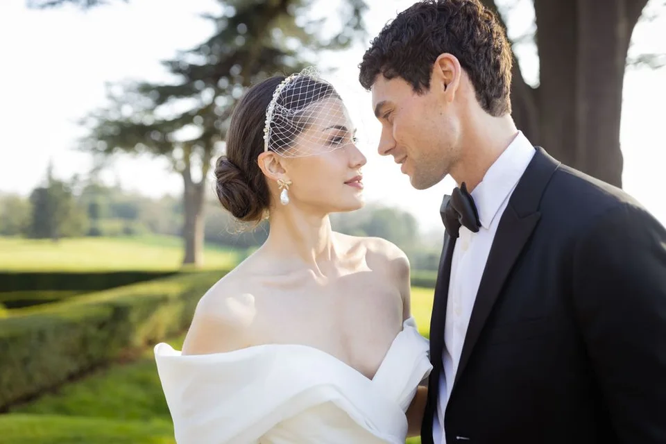 Bride and groom sharing a quiet moment together during their wedding reception in West Sussex, surrounded by nature.