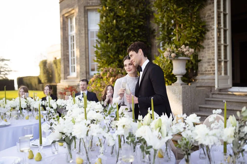 Intimate wedding reception in a charming venue in West Sussex, showcasing elegant decor and joyful celebrations among guests