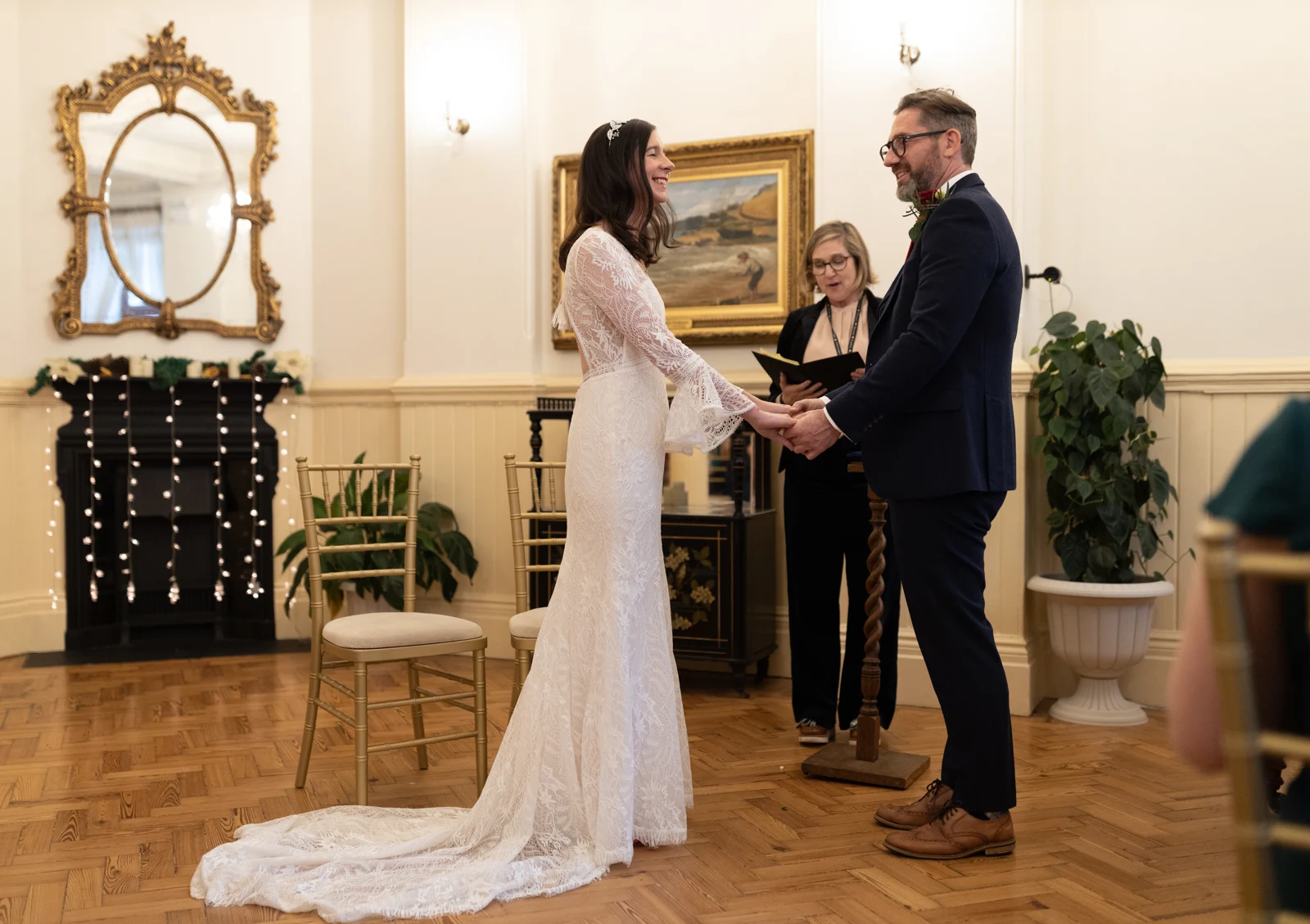 A couple exchanging vows during their Brighton Town Hall ceremony.