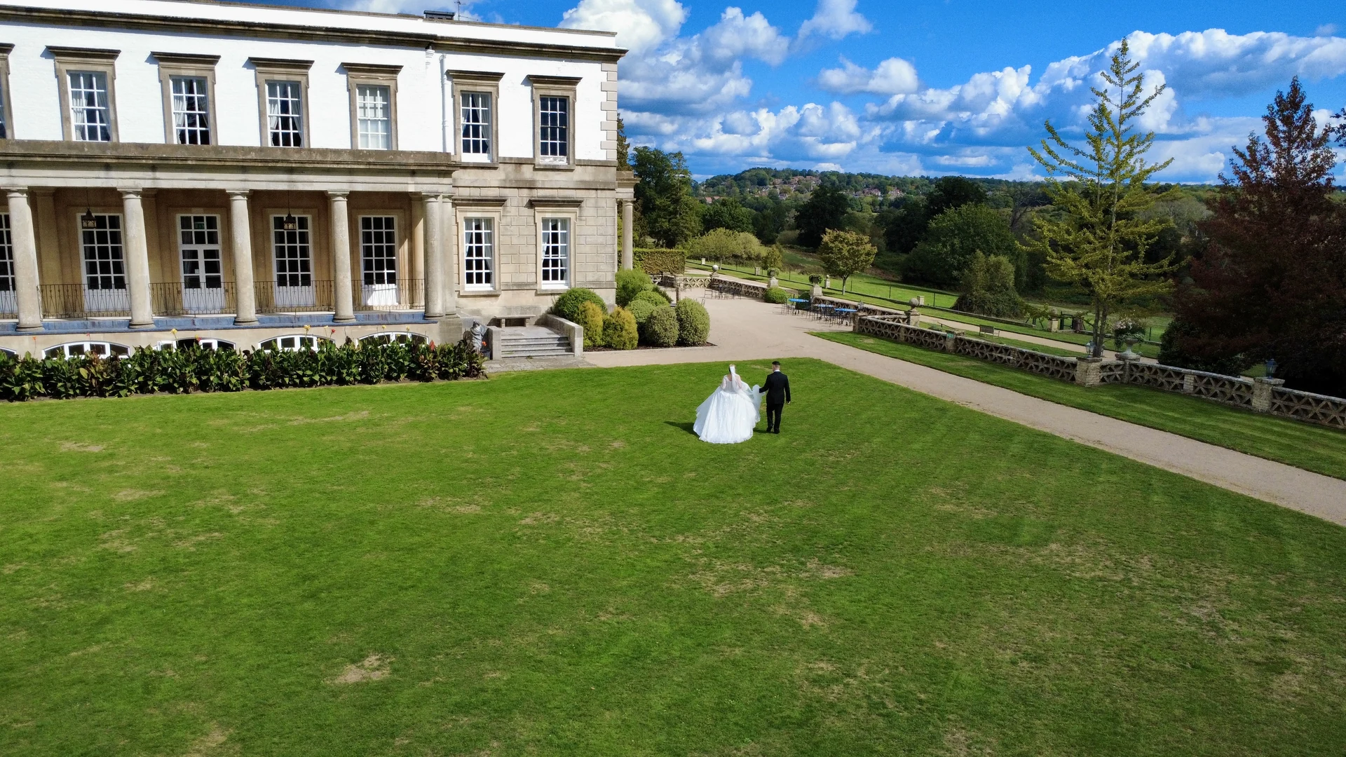 Walking together through the gardens at Buxted Park Hotel