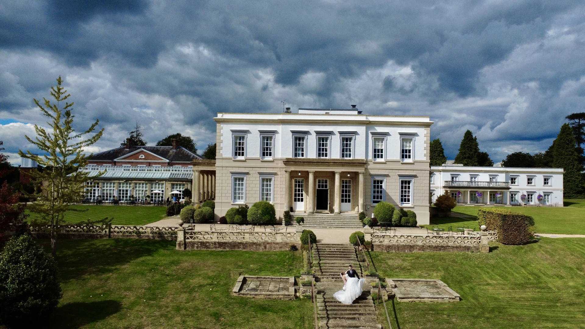 A couple on the garden steps at Buxted Park Hotel