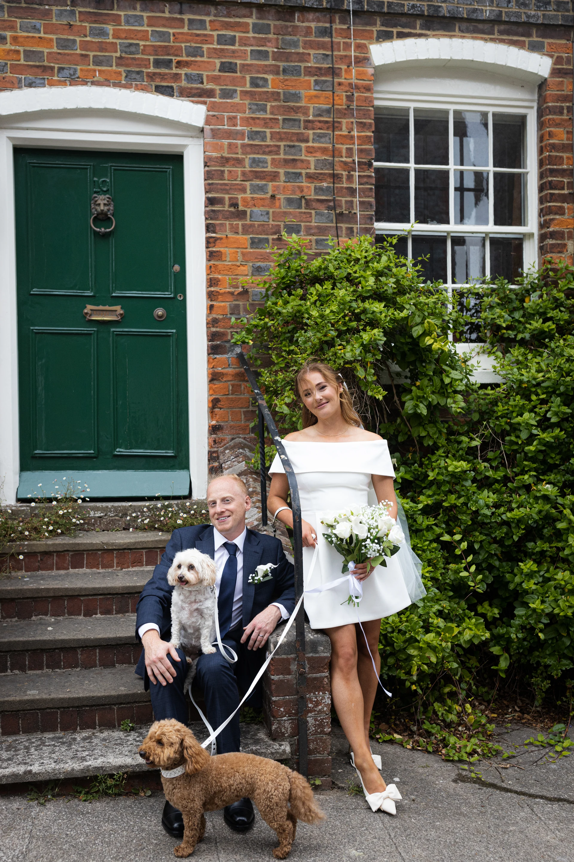 Eddie and Emily with their dogs outside in Arundel