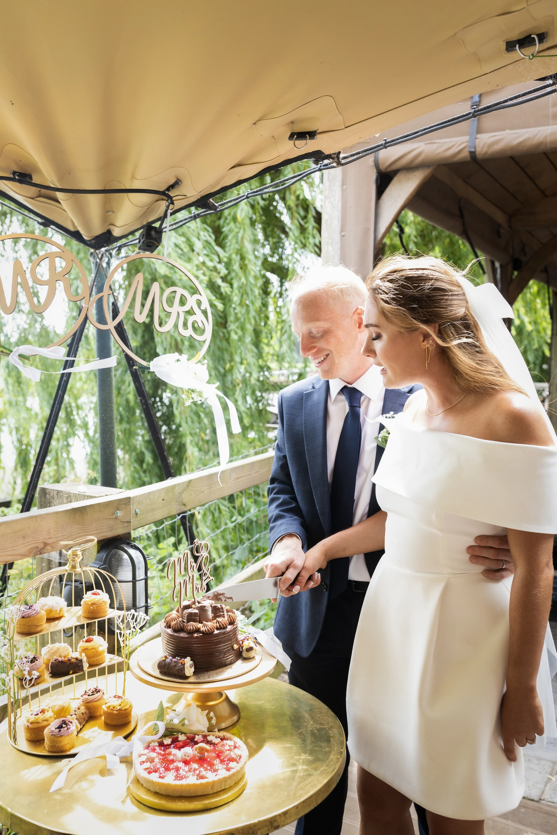 Cutting the cake together at the reception