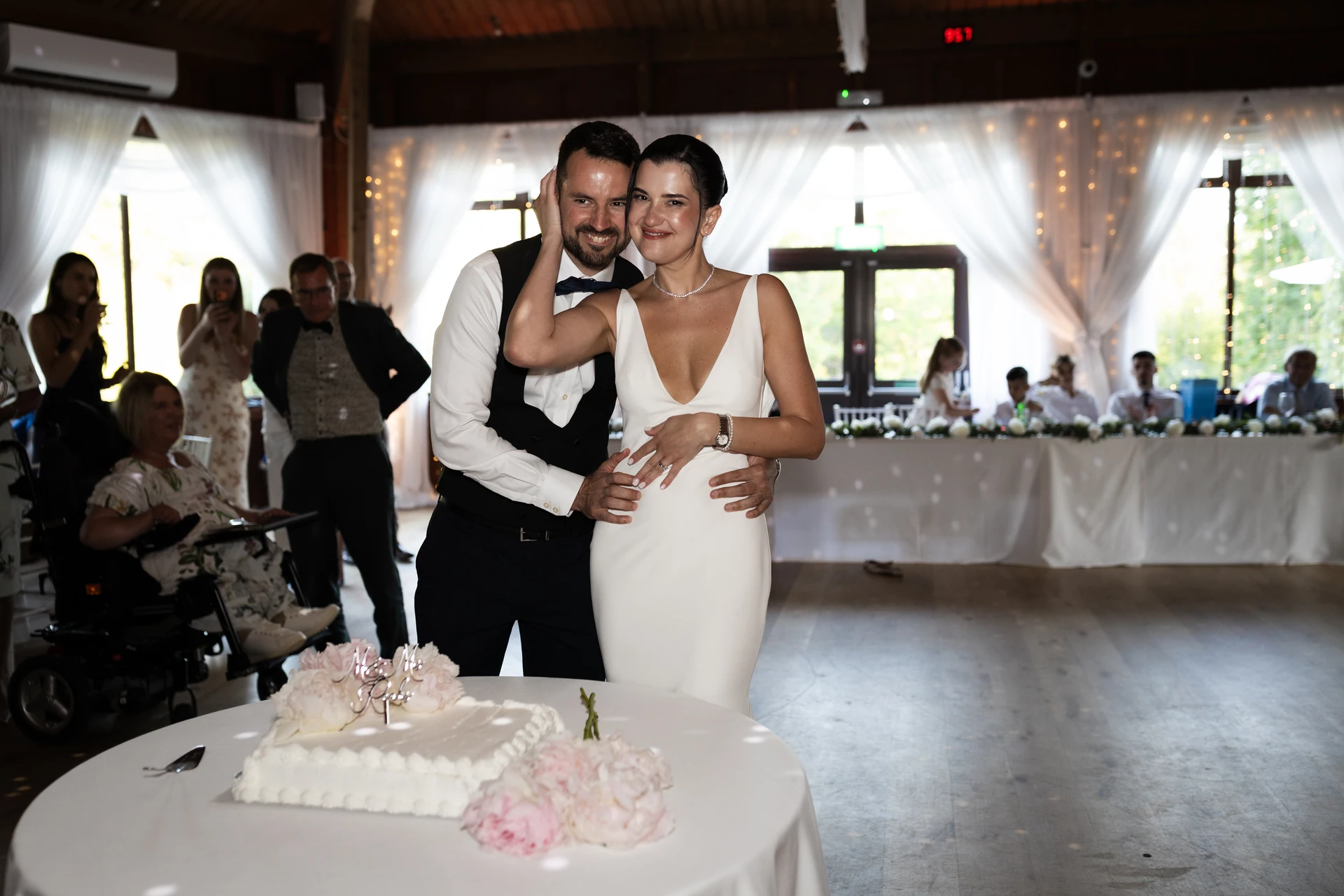 Cutting the cake at the wedding reception