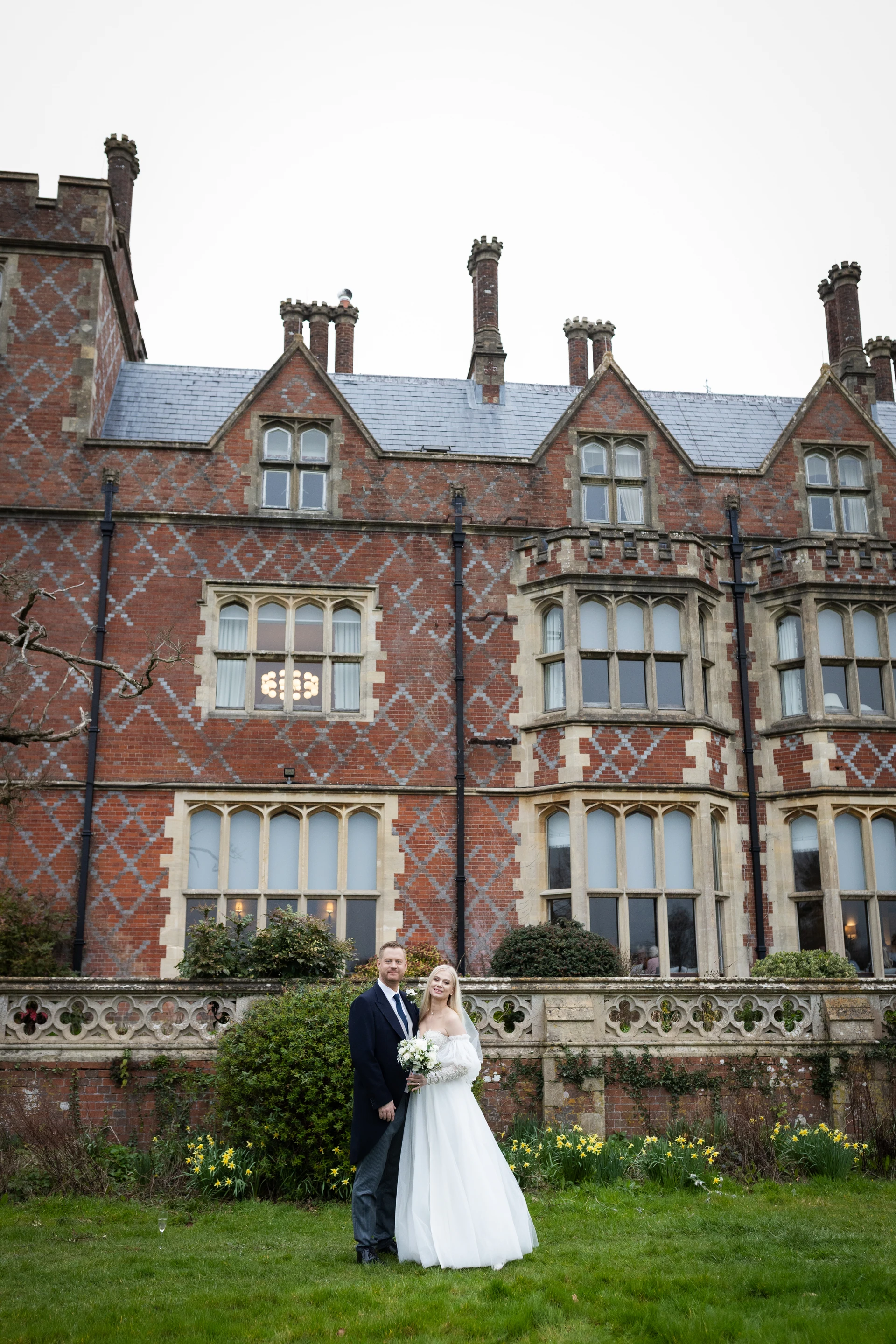 Wedding portraits in front of Horsted Place